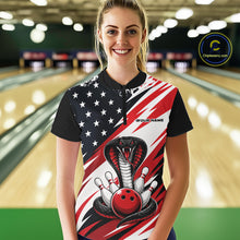 Load image into Gallery viewer, A woman stands in a bowling alley wearing a black, white, and red bowling shirt with stars, diagonal stripes, a cobra, pins, and an red ball.