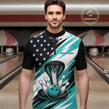 Load image into Gallery viewer, A man stands in a bowling alley wearing a black, white, and blue bowling shirt with stars, diagonal stripes, a cobra, pins, and an blue ball.