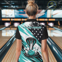 Load image into Gallery viewer, Back view of a woman in a bowling alley wearing a black, white, and blue american flag cobra-themed shirt with “Team Name” across the shoulders.
