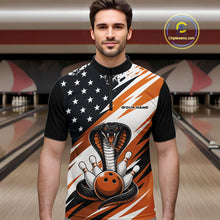 Load image into Gallery viewer, A man stands in a bowling alley wearing a black, white, and orange bowling shirt with stars, diagonal stripes, a cobra, pins, and an orange ball.