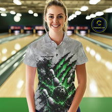 Load image into Gallery viewer, Front view of a female model wearing a gray bowling polo shirt showcasing a dramatic green bowling ball and pins graphic with claw-mark artwork at a bowling lane.