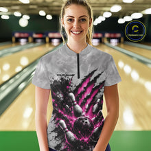 Load image into Gallery viewer, Front view of a female model wearing a gray bowling quarter zip shirt featuring a dramatic pink bowling ball and pins graphic with claw-mark artwork at a bowling lane.