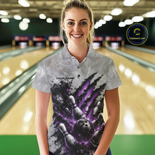 Load image into Gallery viewer, Front view of a female model wearing a gray bowling polo shirt featuring a dramatic purple bowling ball and pins graphic with claw-mark artwork in a bowling lane.