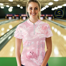 Load image into Gallery viewer, Front view of a female model at the bowling lane wearing a quarter-zip bowling shirt featuring glitter butterflies, roses, bowling pins, and a bowling ball.