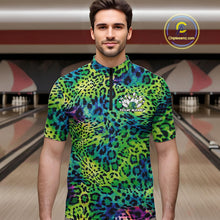 Load image into Gallery viewer, Man in a bowling alley wearing a blue, green, and black leopard-print bowling quarter zip shirt with “Your Name” and a bowling pins graphic on the chest.
