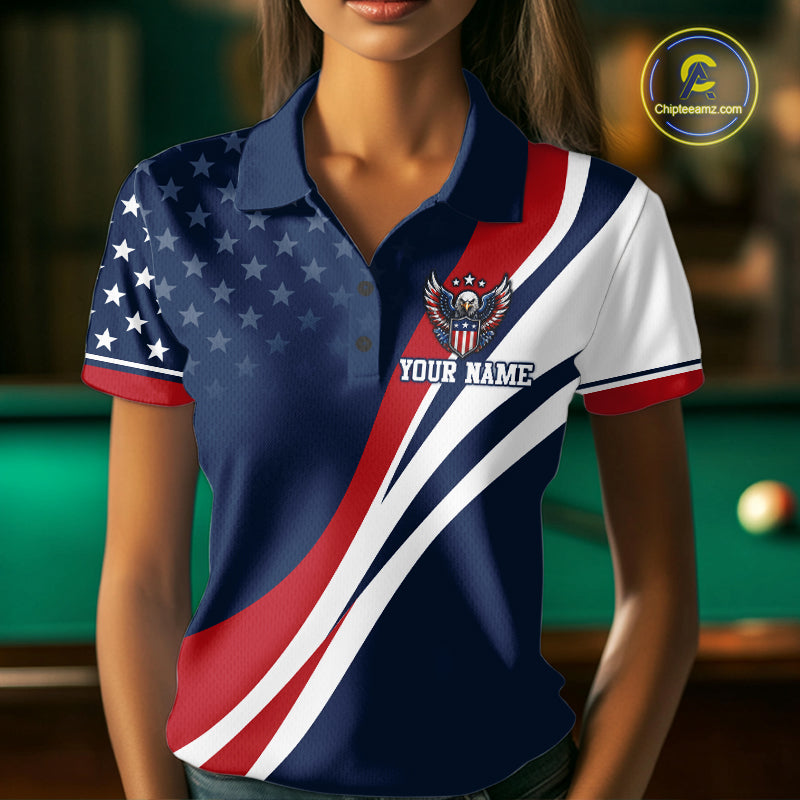 A woman wearing a short-sleeve polo shirt with a patriotic American flag design, featuring a navy blue field with white stars on the right side, diagonal red and white stripes across the front, and a custom eagle crest with the text 'YOUR NAME' on the left chest. 
