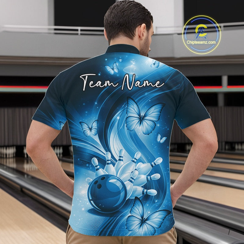 Front view of a blue bowling quarter-zip showcasing a bowling ball hitting pins with colorful butterfly accents.