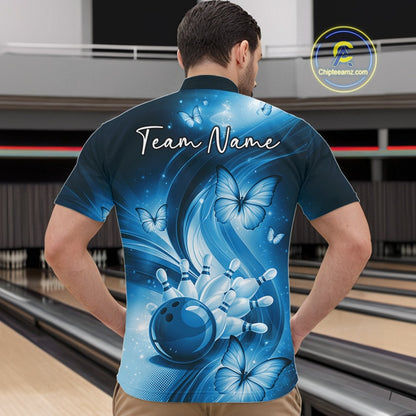 Front view of a blue bowling quarter-zip showcasing a bowling ball hitting pins with colorful butterfly accents.