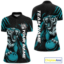 Load image into Gallery viewer, Front and back view of a black and teal blue women's bowling quarter-zip shirt displaying a roaring tiger holding a teal blue bowling ball with matching claw-stripe graphics and a geometric background pattern.