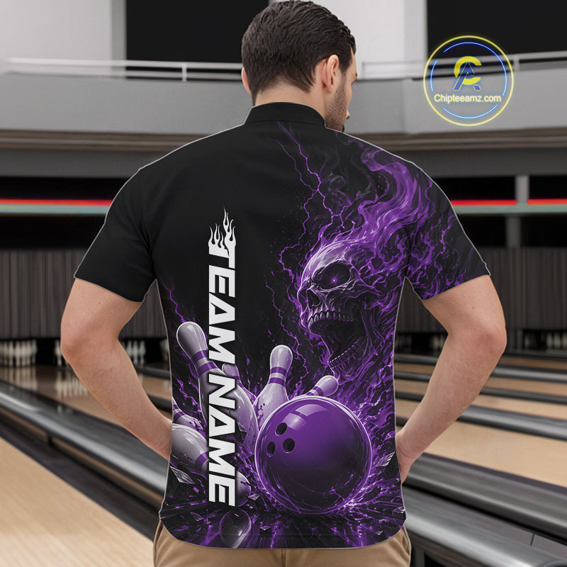 Front view of a male model in a bowling alley wearing a black bowling quarter zip shirt featuring a purple fiery skull design with lightning striking a bowling ball and pins and a custom name.
