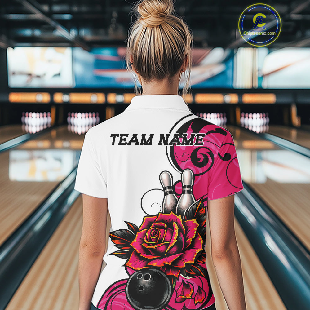 A woman viewed from behind wearing a white bowling polo shirt with a vibrant pink and black graphic design featuring roses, bowling pins, and a bowling ball. 