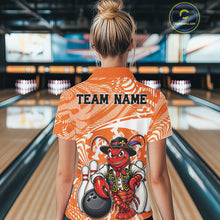 Load image into Gallery viewer, Back view of a female model in a bowling alley wearing an orange custom bowling polo shirt with a funny Cajun crawfish leaning on a bowling ball and a swamp-inspired texture background.