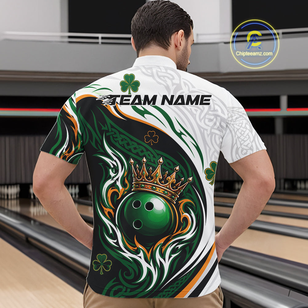 A man viewed from behind wearing a short-sleeve bowling quarter zip shirt with a large back graphic featuring a green bowling ball under a gold crown, swirling green and white patterns, shamrocks, and the text 'TEAM NAME'.