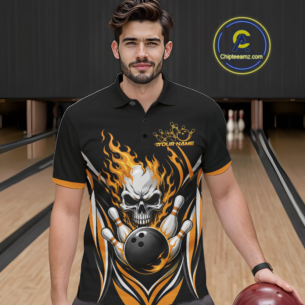A man wearing a black short-sleeve polo shirt with a bold bowling-themed graphic featuring a skull, flaming orange and yellow flames, and bowling pins. 