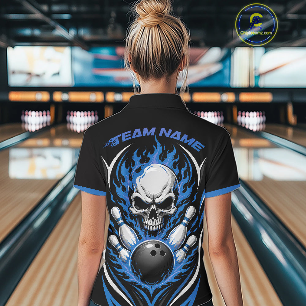 A woman viewed from behind wearing a black short-sleeve bowling shirt with a large back graphic featuring a white skull, blue flames, bowling pins, and a bowling ball, with the text 'TEAM NAME' across the upper back. 