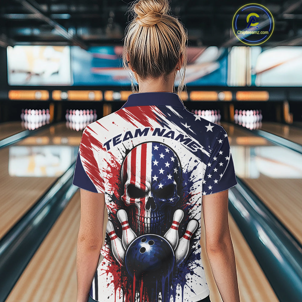 A woman viewed from behind wearing a short-sleeve bowling quarter zip shirt with a patriotic American flag design featuring a skull, bowling pins, and a bowling ball, set against a bowling alley background.