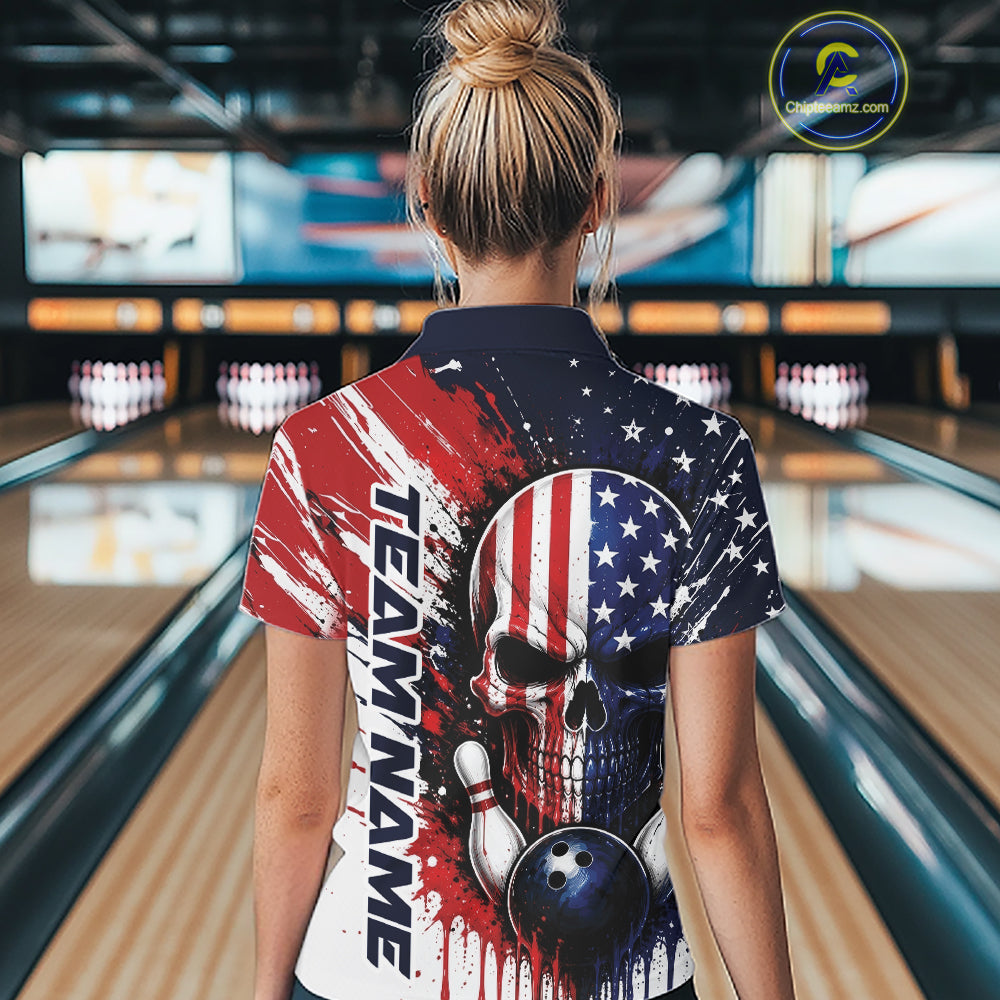 A woman viewed from behind wearing a short-sleeve bowling-themed polo shirt with a red, white, and blue American flag skull design and the text 'TEAMNAME' on the back, standing in a bowling alley.