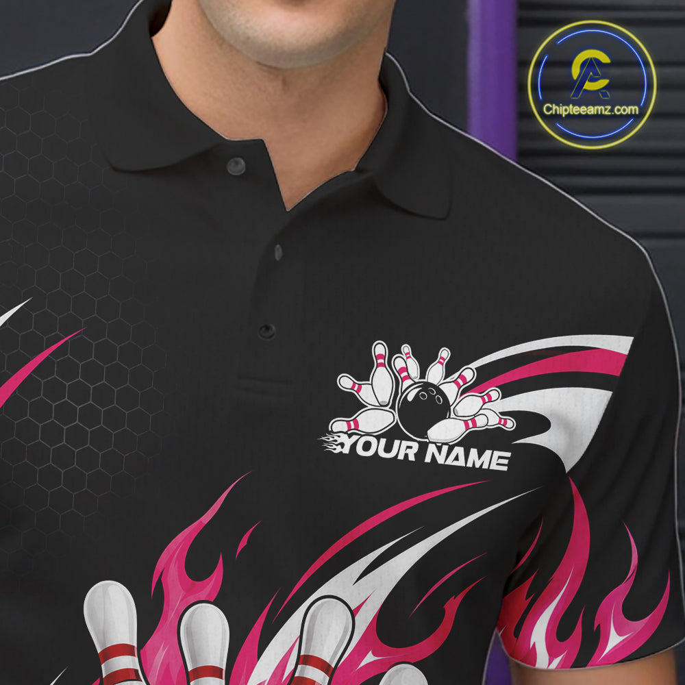 A close-up of a black short-sleeve polo shirt with bowling-themed graphics, including bowling pins, a bowling ball, flame motifs in pink flaming bowling ball and pin graphics