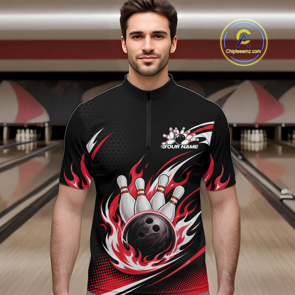 A man wearing a black short-sleeve bowling quarter zip shirt with a red and white flame and bowling pin design