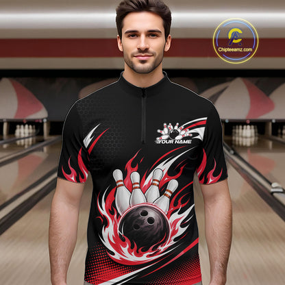 A man wearing a black short-sleeve bowling quarter zip shirt with a red and white flame and bowling pin design