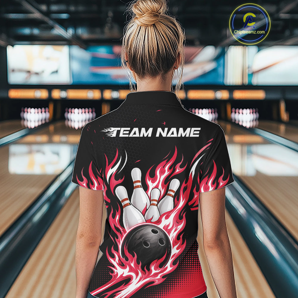 A woman viewed from behind wearing a black short-sleeve bowling jersey with a large graphic print of bowling pins, a bowling ball, and red and pink flames. The jersey has 'TEAM NAME' printed across the upper back.