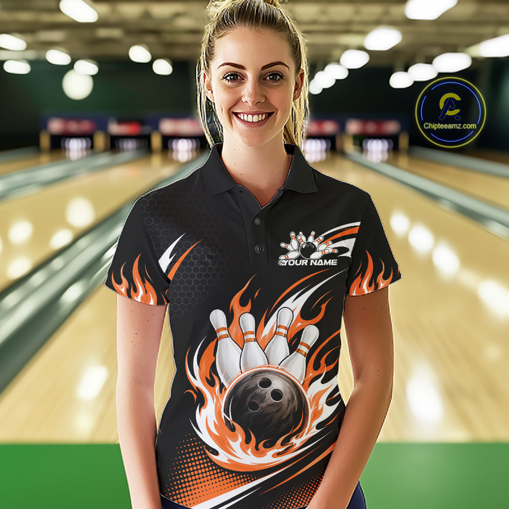 A woman wearing a custom black bowling polo shirt with orange and white flame graphics and a bowling pin/ball print