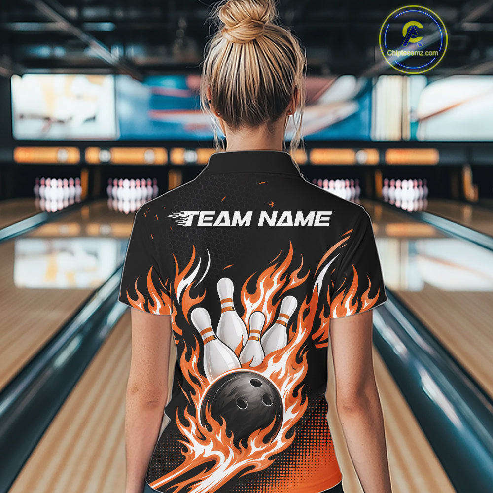 A woman viewed from behind wearing a black bowling-themed short-sleeve shirt with a large graphic of a bowling ball and white pins surrounded by orange and yellow flames, with 'TEAM NAME' printed across the upper back. 