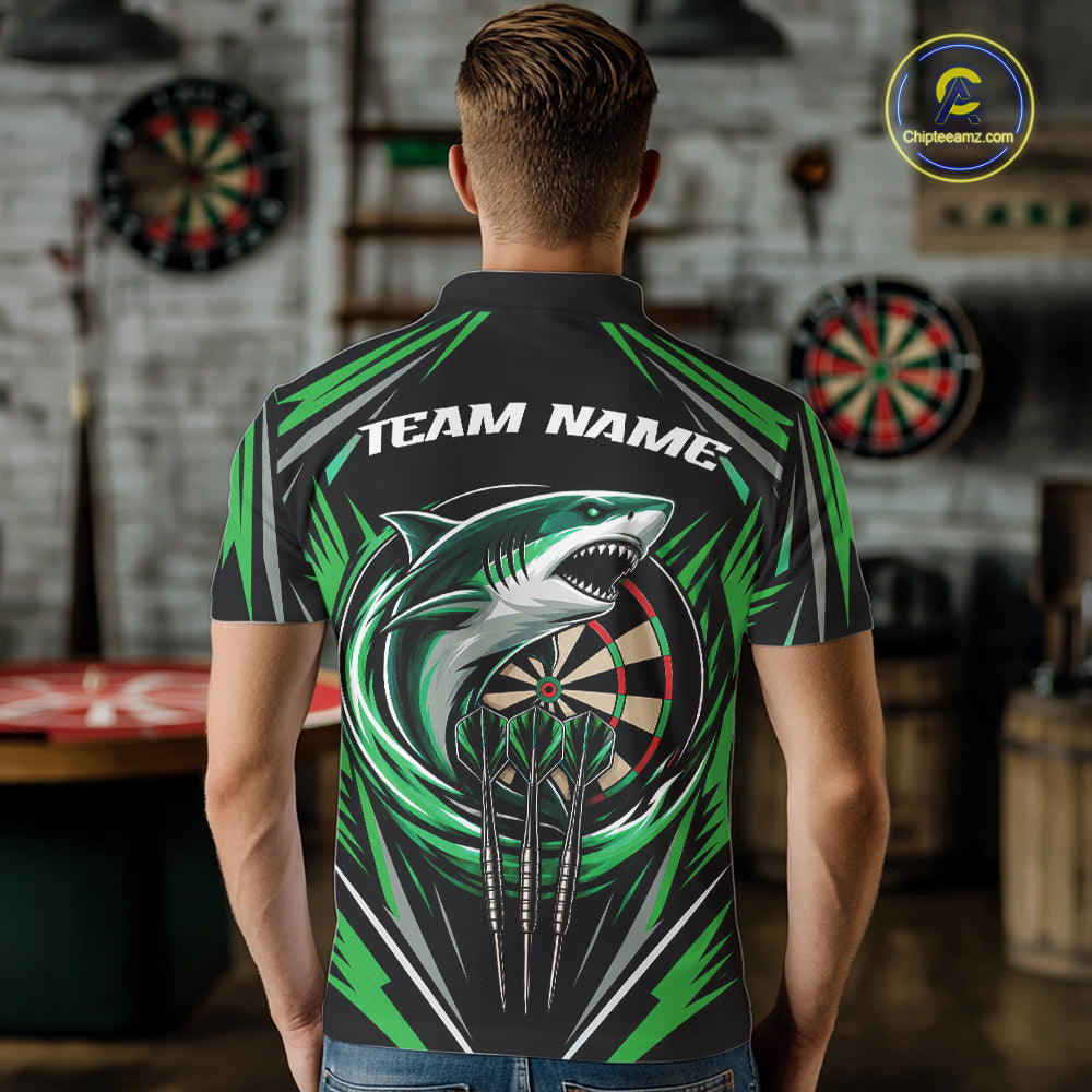 A man viewed from behind wearing a short-sleeve polo shirt with a large shark graphic over a dartboard, green angular accents, and the text 'TEAM NAME' across the upper back. 