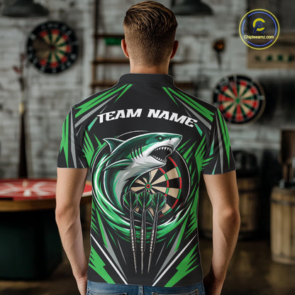 A man viewed from behind wearing a short-sleeve polo shirt with a large shark graphic over a dartboard, green angular accents, and the text 'TEAM NAME' across the upper back. 