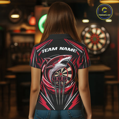 A woman viewed from behind wearing a short-sleeve black polo shirt with a large shark and dartboard graphic on the back