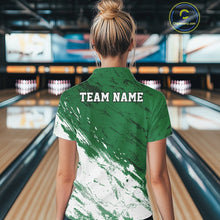 Load image into Gallery viewer, Back view of a female model in a bowling alley wearing a bowling quarter-zip shirt featuring a white paint splatter distressed sportswear design on a green shirt.
