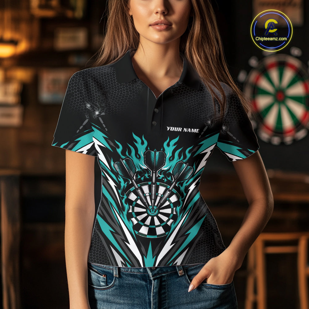 A woman wearing a black short-sleeve polo shirt with a detailed dartboard and flame graphic in teal, white, and black. 