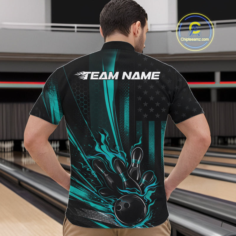 Front view of a male model in a bowling venue wearing a black and turquoise blue quarter-zip shirt showcasing a patriotic bowling ball striking pins design.
