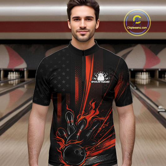 Male model at a bowling lane wearing a black and orange bowling quarter-zip shirt with patriotic bowling-themed graphics and flag-inspired accents.