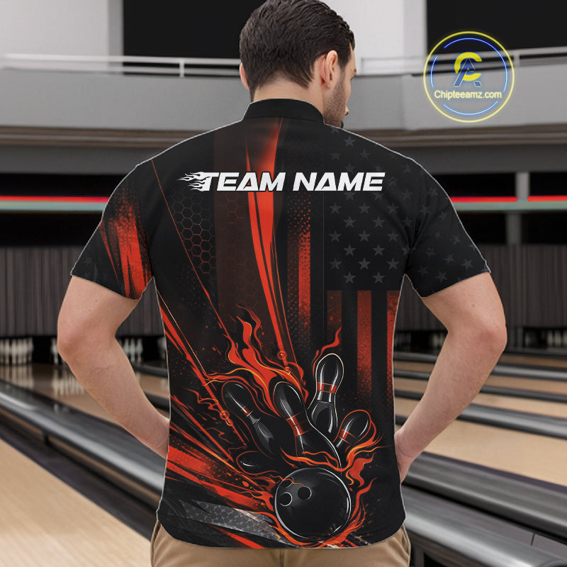 Front view of a male model in a bowling alley wearing a black and orange quarter-zip shirt featuring a patriotic bowling strike scene.