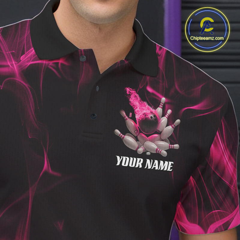 Close-up of a black and pink bowling polo shirt left chest featuring bowling strike graphics with a fiery background.