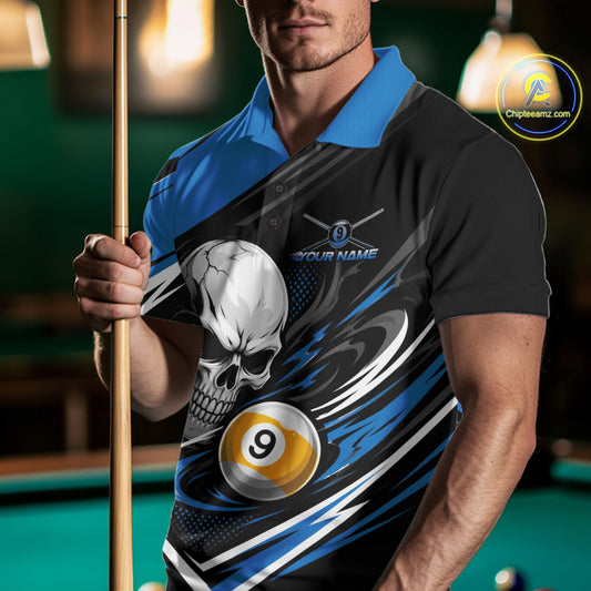 A man in a poolroom wearing a black and blue polo shirt with a skull and billiard 9-ball graphic, holding a pool cue. 