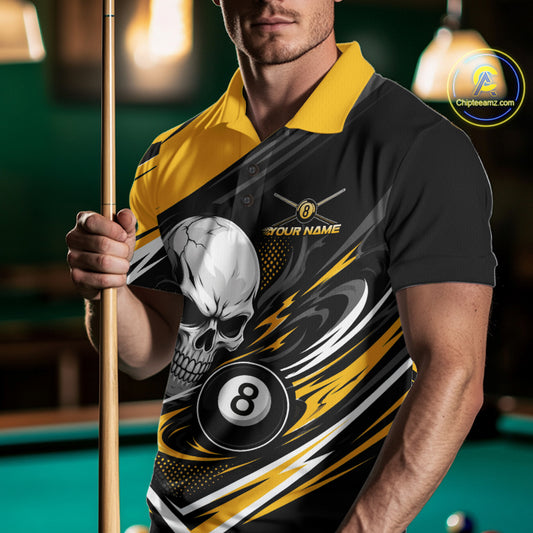 A man in a pool hall wearing a black and yellow billiard polo shirt with a skull, 8-ball, and lightning graphic