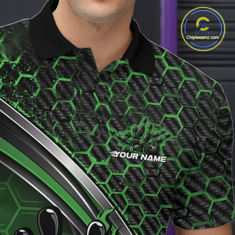Close-up of the left chest area of a black and green bowling polo shirt, featuring honeycomb pattern with a flaming bowling ball hitting pins.
