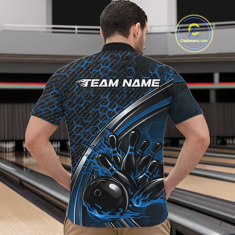 Male model in a bowling alley wearing a black and blue quarter zip shirt, showcasing honeycomb accents and a dynamic flame bowling strike illustration.