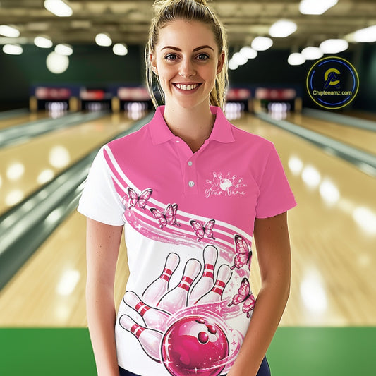 Front view of a female model in a white and pink bowling polo featuring butterfly graphics and colorful bowling artwork