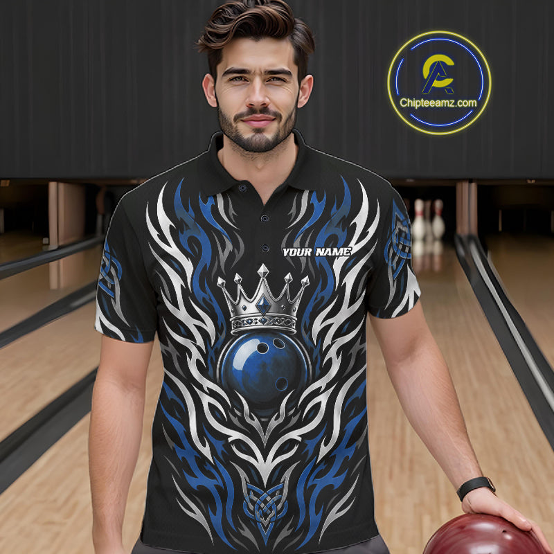 A man wearing a custom bowling short-sleeve polo shirt with a blue, white, and black flame design and a crown graphic, standing in a bowling alley.