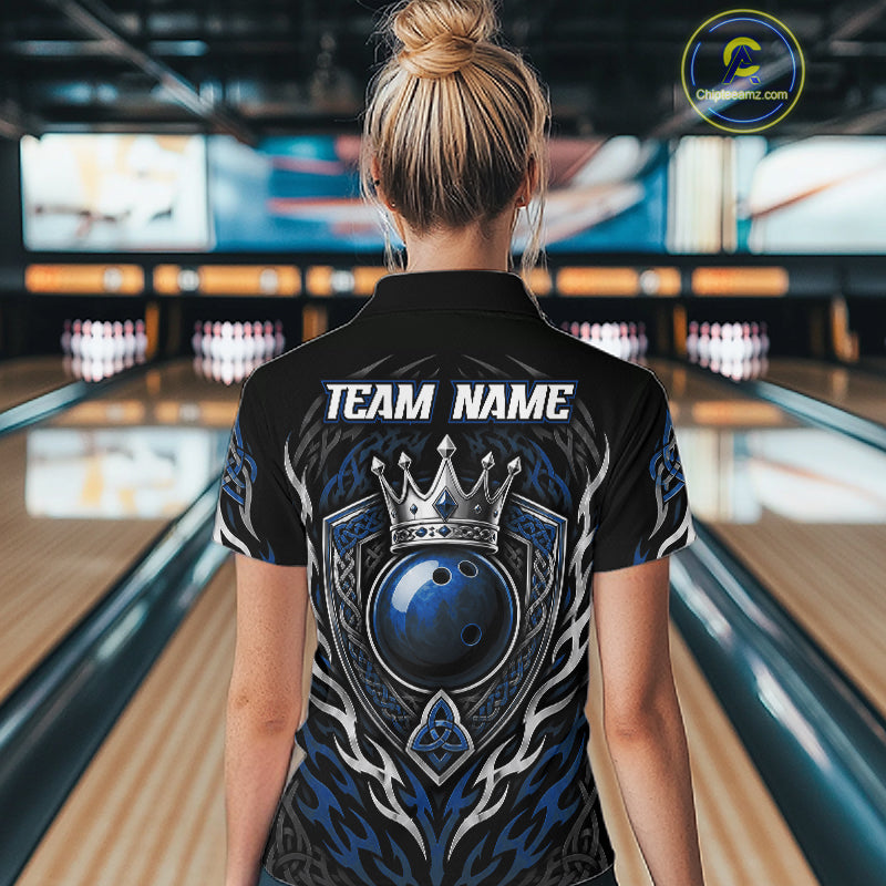 A woman viewed from behind wearing a black bowling shirt with a large blue, gray, and silver graphic on the back featuring a crown and bowling ball, with 'TEAM NAME' printed in white. 