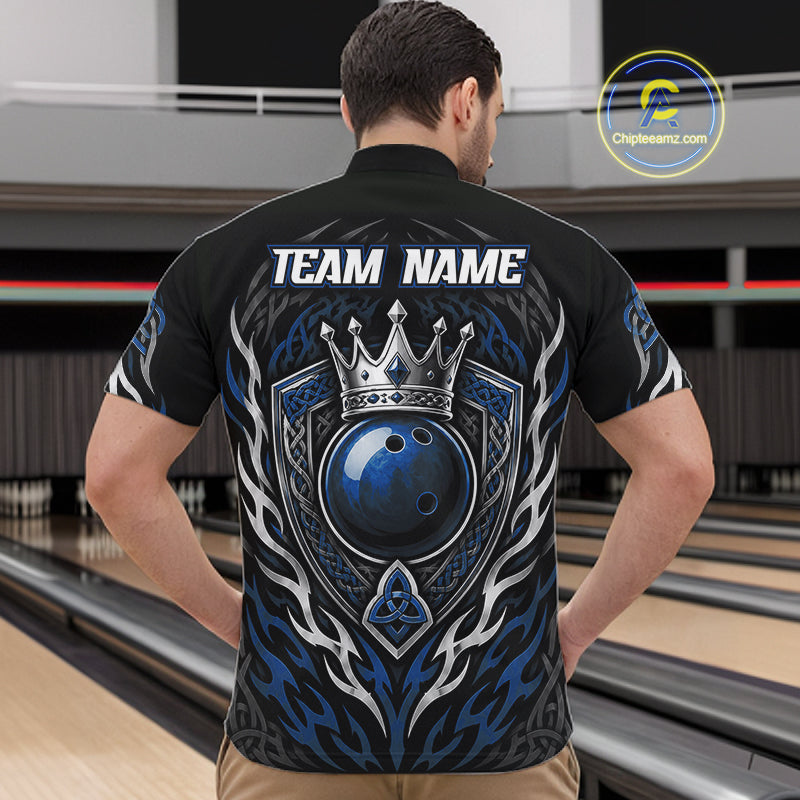 A man viewed from behind wearing a black bowling-themed short-sleeve shirt with a large blue, silver, and white graphic on the back featuring a crown, bowling ball, and tribal-style flame patterns. 