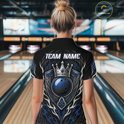 A woman viewed from behind wearing a black bowling shirt with a large blue, gray, and silver graphic on the back featuring a crown and bowling ball, with 'TEAM NAME' printed in white. 
