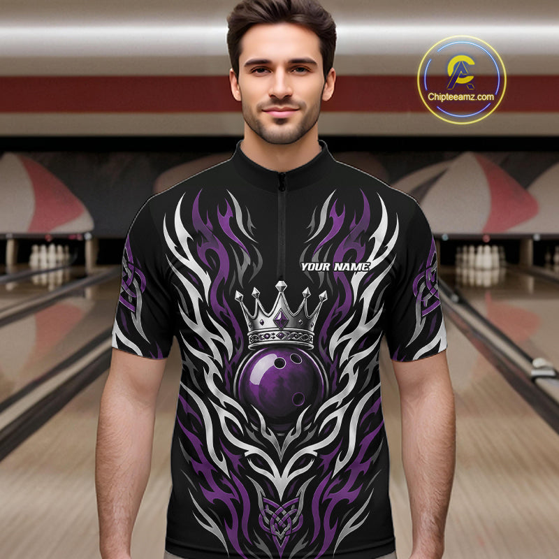 A man wearing a black short-sleeve quarter zip bowling jersey with a purple and silver tribal flame design, a crown graphic, and a purple bowling ball motif. 