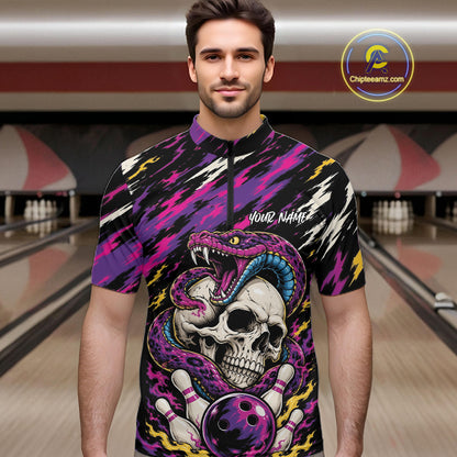 A man wearing a short-sleeve bowling-themed graphic quarter zip shirt with a skull, snake, and bowling ball design on a black background with purple, pink, and yellow accents.