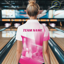 Load image into Gallery viewer, Back view of a female model in a bowling lane wearing a white and pink quarter zip shirt with bowling ball and pins over a pink geometric background.