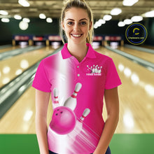 Load image into Gallery viewer, Female model front view at the bowling lane wearing a bowling polo shirt with bowling ball and pins flowing through a pink gradient design.