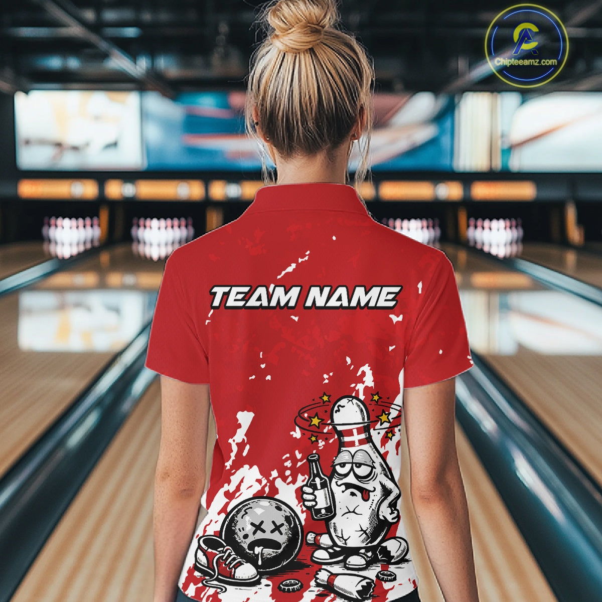 Back view of a female bowler wearing a red and white polo shirt, splatter-style drunk bowling pin illustration holding beer bottle and bowling ball.